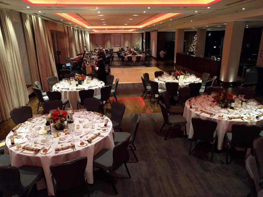 Riverside Room Laid Out For Christmas Dinner on round tables