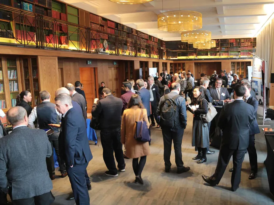 Conference Delegates Networking In The Maxwell Library